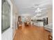 Open concept living area with hardwood floors and kitchen views at 1612 Staunton St, The Villages, FL 32162