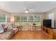 Relaxing living room with large windows and ample natural light at 1612 Staunton St, The Villages, FL 32162