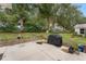 Private patio area with stone border and grill at 1612 Staunton St, The Villages, FL 32162