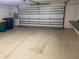 Attached garage with automatic door and storage at 1964 Banning Beach Rd, Tavares, FL 32778