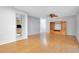 Living room with hardwood floors and built in shelving at 26141 Biltmore St, Sorrento, FL 32776