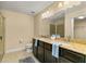 Double vanity bathroom with granite countertop and walk-in shower at 30529 Lipizzan Ter, Mount Dora, FL 32757