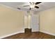 Spacious bedroom featuring hardwood floors and an adjacent room at 30529 Lipizzan Ter, Mount Dora, FL 32757