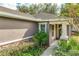 Side view of house with walkway and landscaping at 30529 Lipizzan Ter, Mount Dora, FL 32757