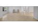 Bright and airy living room with tile floors and access to other rooms at 34929 Cutoff Rd, Fruitland Park, FL 34731