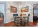 Cozy dining area with a glass-top table and four chairs at 4130 Capland Ave, Clermont, FL 34711