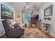 Relaxing Gathering room with a fireplace, leather recliner, and entertainment center at 4130 Capland Ave, Clermont, FL 34711
