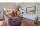 Open concept living area with kitchen island and hardwood floors at 4130 Capland Ave, Clermont, FL 34711