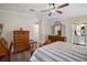 Main bedroom with wooden furniture and en-suite bathroom access at 4601 Belle Grv, Leesburg, FL 34748