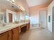 Double vanity bathroom with soaking tub and walk-in shower at 4634 Summerbridge Cir, Leesburg, FL 34748