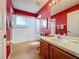 Clean bathroom with red walls and a shower/tub combo at 4634 Summerbridge Cir, Leesburg, FL 34748