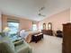 Spacious Primary bedroom with ample natural light and room for seating at 4634 Summerbridge Cir, Leesburg, FL 34748