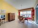 Charming dining area with wood table and chairs, near kitchen at 4634 Summerbridge Cir, Leesburg, FL 34748