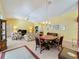 Open concept dining area with a view of the living room at 4634 Summerbridge Cir, Leesburg, FL 34748