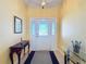Bright entryway with a wood console table and a glass-top table at 4634 Summerbridge Cir, Leesburg, FL 34748