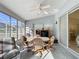 Spacious sunroom with comfortable seating and natural light at 4634 Summerbridge Cir, Leesburg, FL 34748