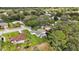 Aerial view showing home's location in a quiet tree-lined neighborhood at 5533 Grove Mnr, Lady Lake, FL 32159