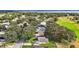 Aerial view of single Gathering home with a large backyard in a golf course community at 5533 Grove Mnr, Lady Lake, FL 32159