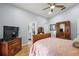 Spacious bedroom with wood floors and ceiling fan at 5533 Grove Mnr, Lady Lake, FL 32159