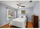 Bright bedroom with wood floors and ceiling fan at 5533 Grove Mnr, Lady Lake, FL 32159