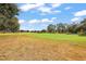 Scenic view of a lush green golf course at 5533 Grove Mnr, Lady Lake, FL 32159