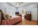 Bedroom with ensuite bathroom and large windows at 5533 Grove Mnr, Lady Lake, FL 32159