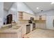 Light beige kitchen with double sink and stainless steel appliances at 5533 Grove Mnr, Lady Lake, FL 32159