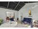 Screened porch with view of backyard and living room at 5533 Grove Mnr, Lady Lake, FL 32159