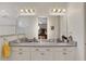 Elegant bathroom with double vanity and granite countertops at 8099 Bridgeport Bay Cir, Mount Dora, FL 32757