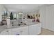 Kitchen island with granite countertops and double sink at 8099 Bridgeport Bay Cir, Mount Dora, FL 32757