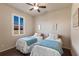 Bedroom with two twin beds and a ceiling fan at 10233 Kabana Blvd, Clermont, FL 34711