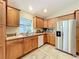 Kitchen with stainless steel appliances and ample wood cabinetry at 1415 E 9Th Ave, Mount Dora, FL 32757