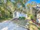 White storage shed with ramp and landscaping at 1415 E 9Th Ave, Mount Dora, FL 32757