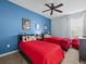 Twin bedroom with red bedding and Mickey Mouse decor at 2814 Mayport St, Clermont, FL 34711