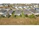 Aerial view of homes with backyards and landscaping at 29549 Caspian St, Leesburg, FL 34748