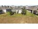 Aerial view of homes with backyard and landscaping at 29549 Caspian St, Leesburg, FL 34748