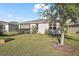 Backyard with raised garden bed and landscaping at 29549 Caspian St, Leesburg, FL 34748