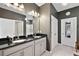 Bathroom boasts double sinks, dark countertops, and ample storage at 29549 Caspian St, Leesburg, FL 34748