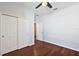 Well-lit bedroom with wood floors and double door closet at 29549 Caspian St, Leesburg, FL 34748