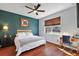 Spacious bedroom with ceiling fan, wood floors and built-in workspace at 29549 Caspian St, Leesburg, FL 34748