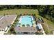 Aerial view of community pool with lounge chairs and cabanas at 29549 Caspian St, Leesburg, FL 34748