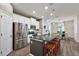 Open concept kitchen with island, stainless steel appliances, breakfast bar at 29549 Caspian St, Leesburg, FL 34748