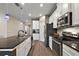 Modern kitchen with stainless steel appliances and an island at 29549 Caspian St, Leesburg, FL 34748