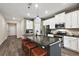 Open concept kitchen with an island and breakfast bar at 29549 Caspian St, Leesburg, FL 34748