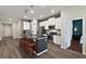 Open concept kitchen with island and stainless steel appliances at 29549 Caspian St, Leesburg, FL 34748