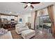 Open living room with kitchen and patio access at 29549 Caspian St, Leesburg, FL 34748