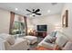 Living room with comfy sofas and access to a patio at 29549 Caspian St, Leesburg, FL 34748
