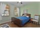 Bedroom with hardwood floors and a double window at 30628 Lipizzan Ter, Mount Dora, FL 32757