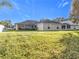 Large backyard with grassy lawn at 31748 Parkdale Dr, Leesburg, FL 34748
