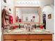 Double vanity bathroom with granite countertop and large mirror at 31748 Parkdale Dr, Leesburg, FL 34748